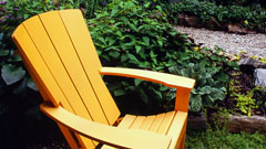 Adirondack chair within garden setting